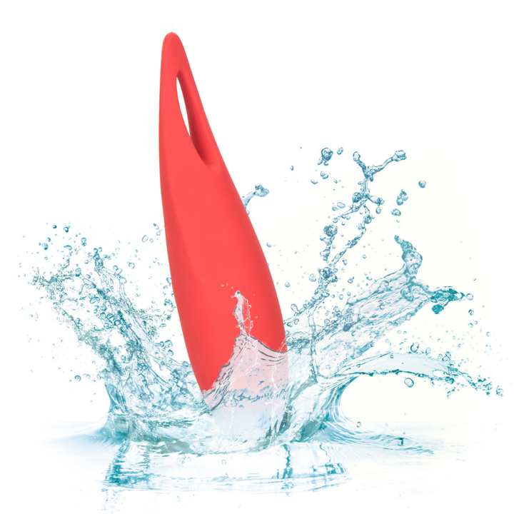 Red clit encasing vibe with water splashes on a white background