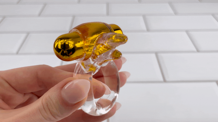 GIF of lube jiggling off of CalExotics. Pure Gold Double Trouble Enhancer 