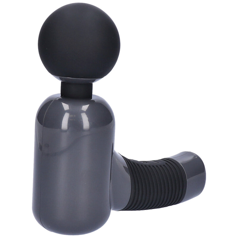 Massage gun lying on it&