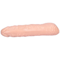 Underside view of beige hollow penis extender.