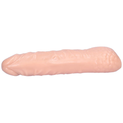 Underside view of beige hollow penis extender.