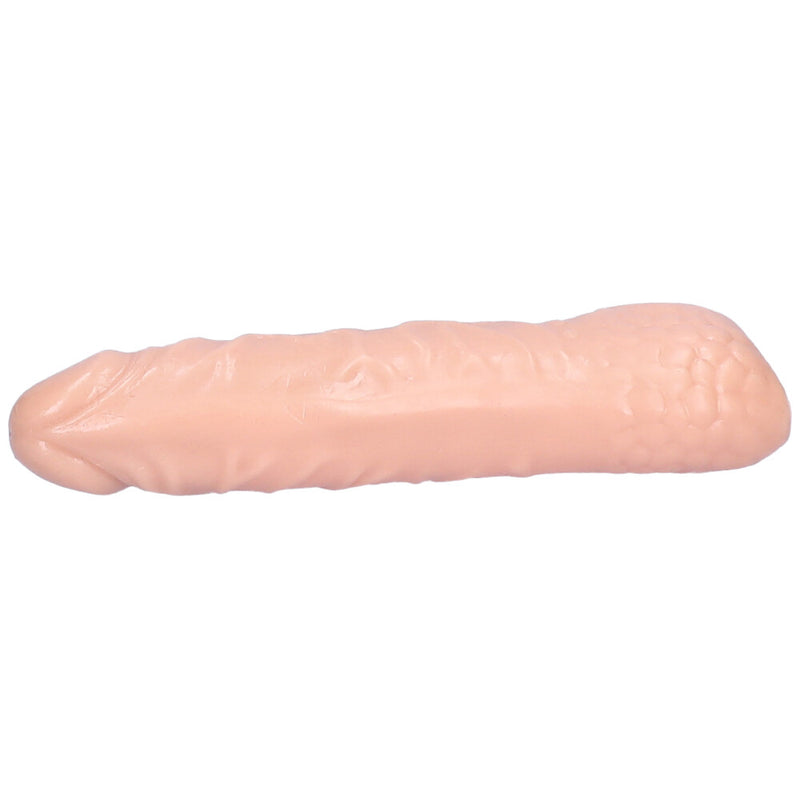 Underside view of beige hollow penis extender.