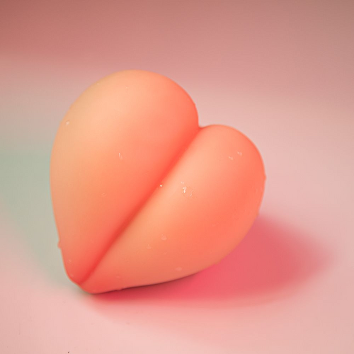 Peach Masturbator view from the side of the toy.
