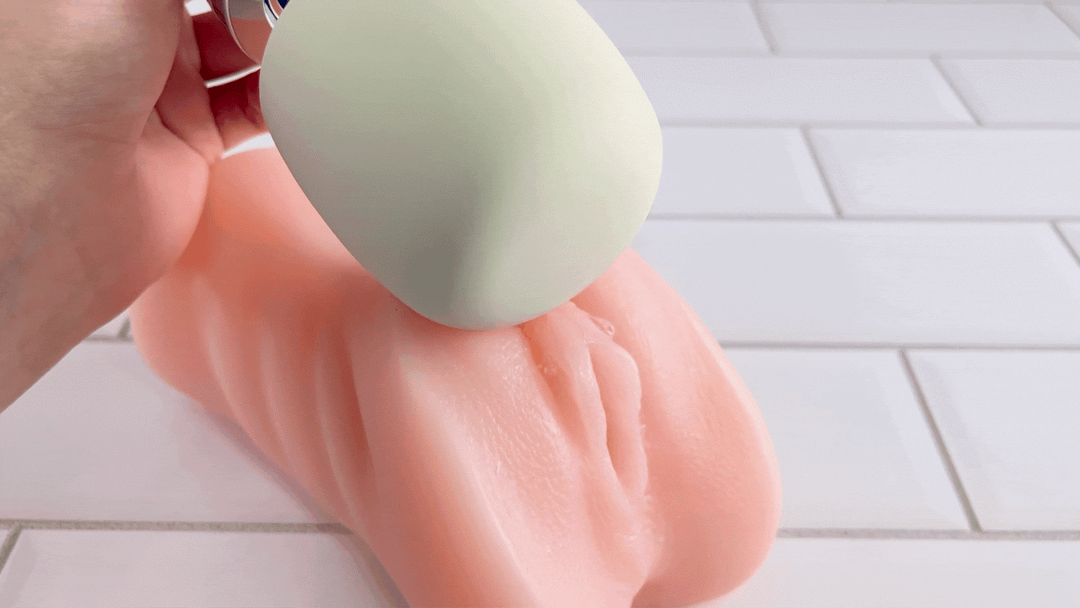GIF of Rechargeable Magic Wand being used on well lubed fake clitoris 
