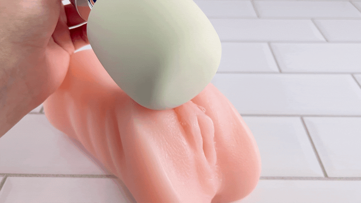 GIF of Rechargeable Magic Wand being used on well lubed fake clitoris 