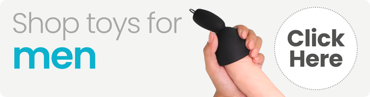 A hand holding a black handheld personal massager, with promotional text reading 'Shop toys for men' and a gray 'Click Here' button on a light background.