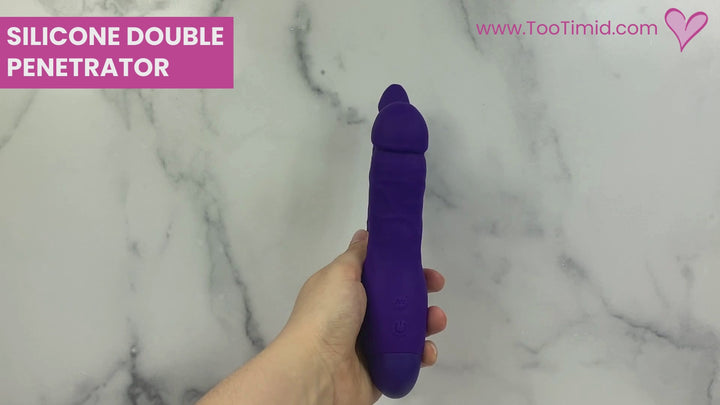 Video of double penetration dildo in action and being used on a model of a vagina