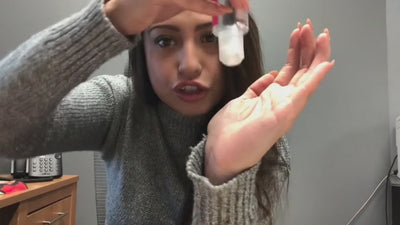 Video with lube being poured into hand and fingers rubbed together to show the consistency of the lube