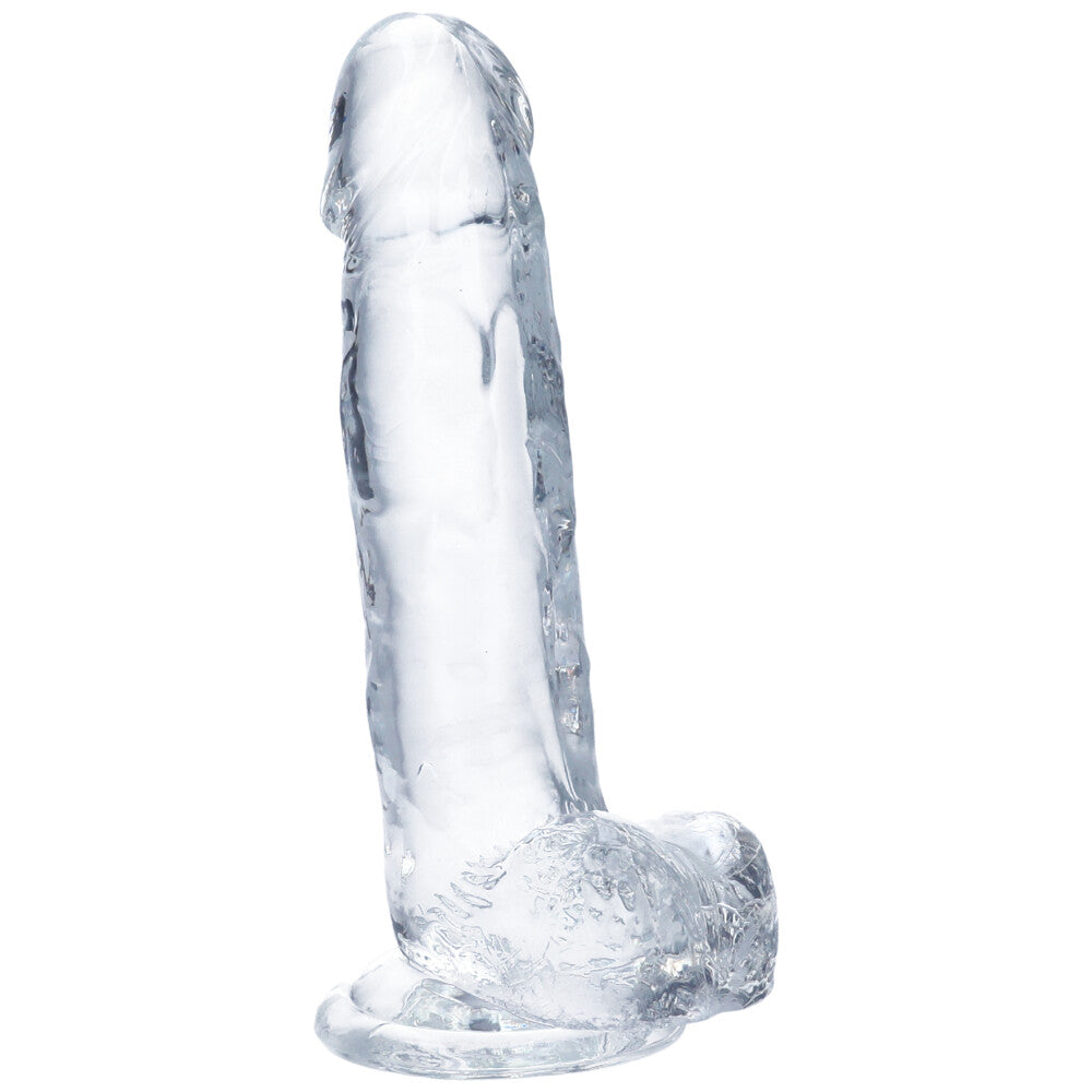 Alternate side view of large clear realistic suction cup dildo with balls.