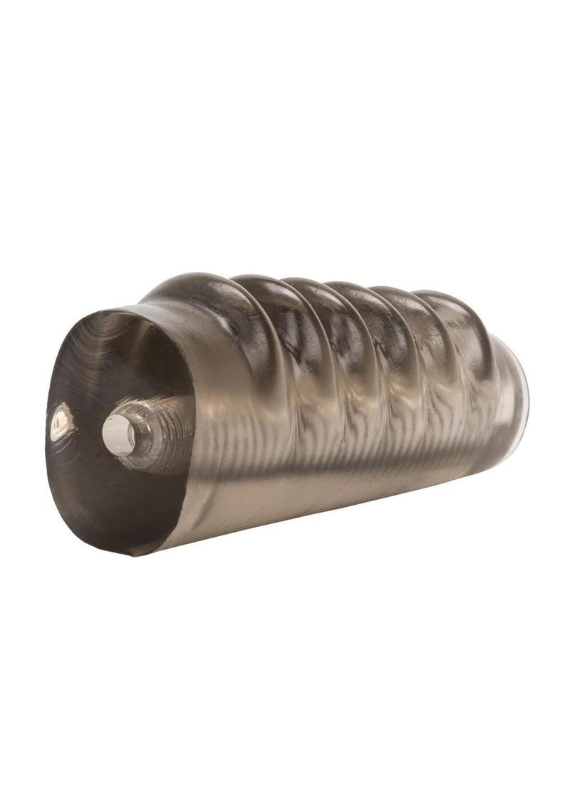 Metallic cylindrical object with ribbed design on a white background