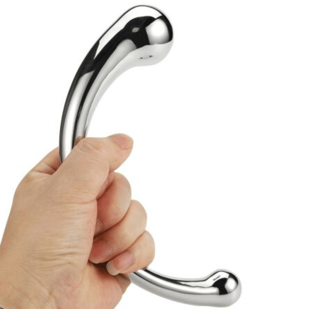 Image of hand holding the stainless steel wand dildo.