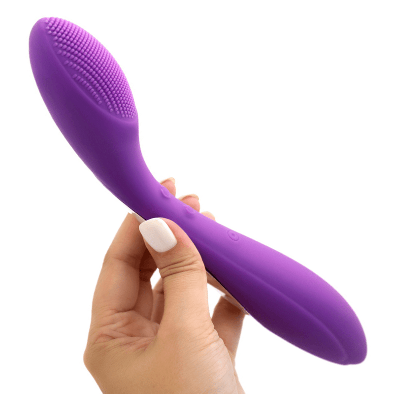 Image of the G-spot vibrator held in hand and turned slightly to the side.