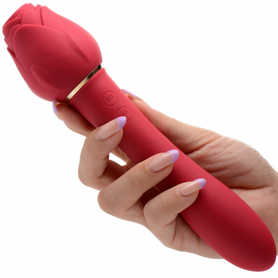Image of model holding the bloomgasm dual-ended rose wand vibrator.