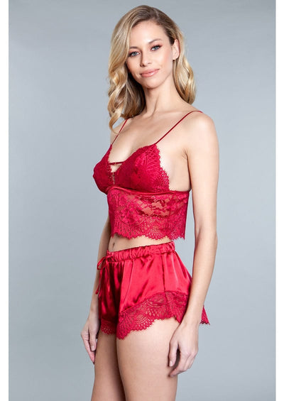 Side view of red satin top and shorts set.