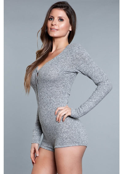 1 Piece. Long-sleeve romper with scoop neckline, button snaps, and cuffs facing left wearing grey