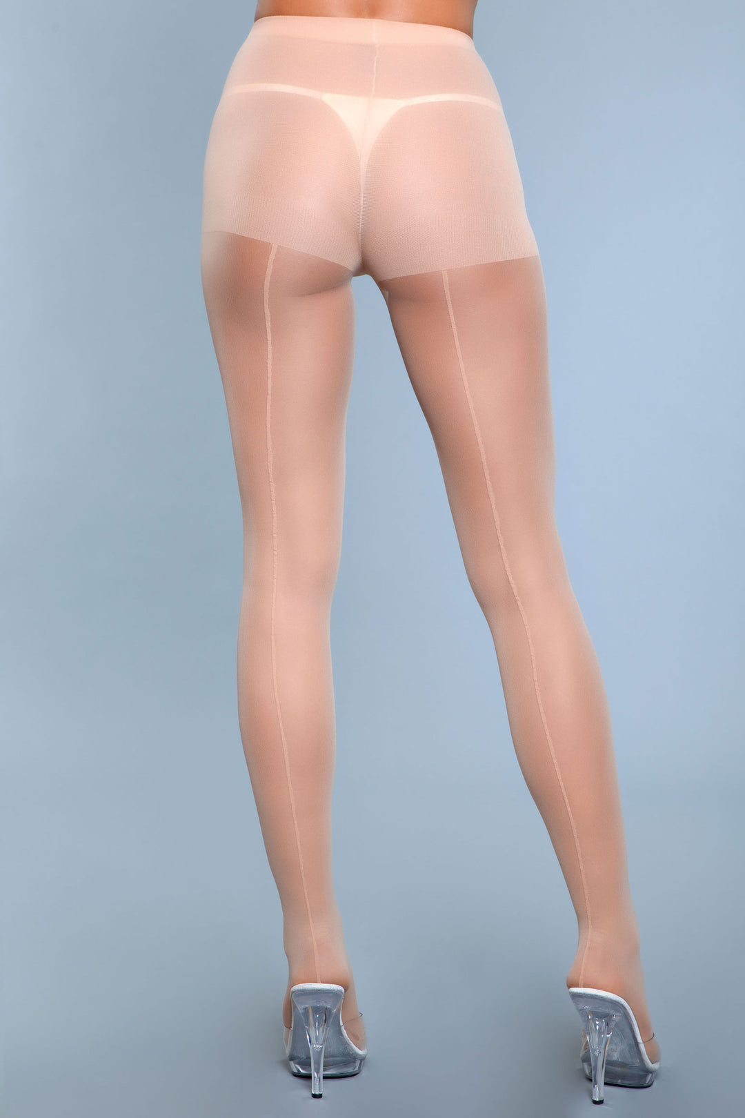 Model facing back wearing beige pantyhose with backseam up calves and thighs