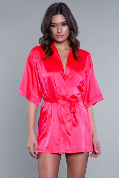 Model facing forward wearing hot pink satin robe with side pockets. 3/4 sleeves and satin sash front tie