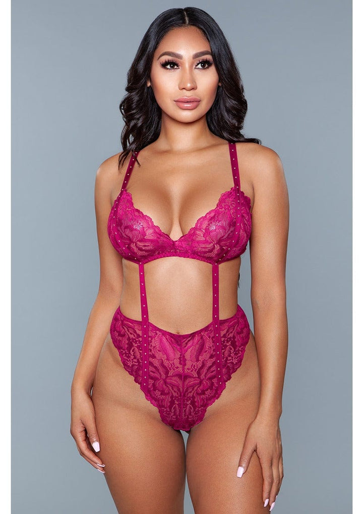 1 Piece. Lace wireless with cut-outs, stud details, and thong bottom closure facing forward