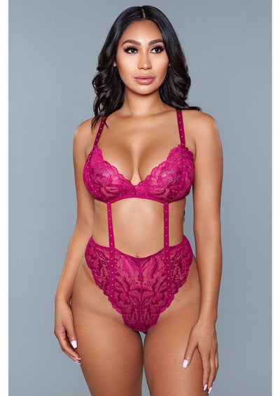 1 Piece. Lace wireless with cut-outs, stud details, and thong bottom closure facing forward