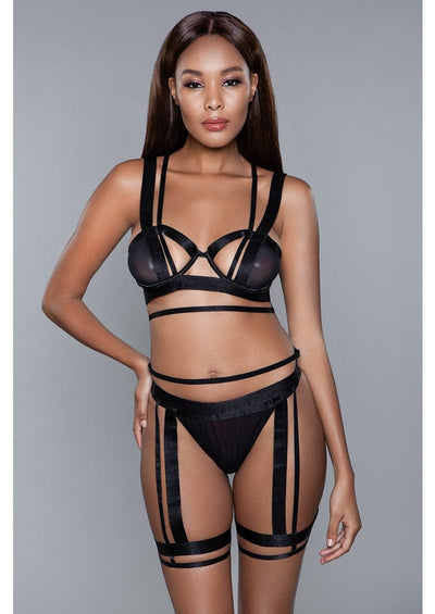 Black 3 piece lingerie set with strappy bra and thigh harness.