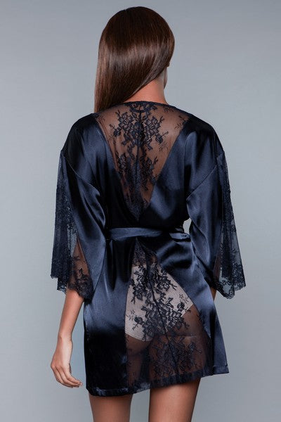 Model facing back wearing navy Satin and lace robe with Partial lace sleeves, Lace trim detail on back and tie sash