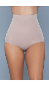 Model wearing seamless high-waisted tummy control body shaper in beige facing forward close up