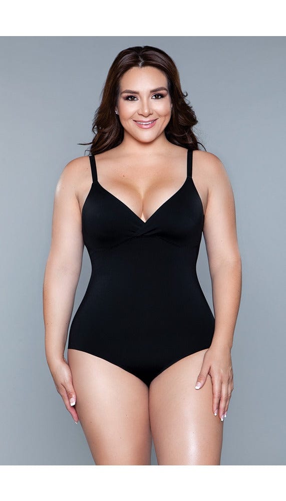 Model wearing seamless bodysuit body shaper with adjustable straps, and snap bottom closure in black facing forward
