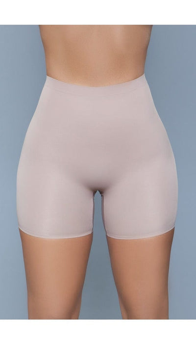 Model wearing seamless mid waist and anti-chafing slip shorts in beige facing forward