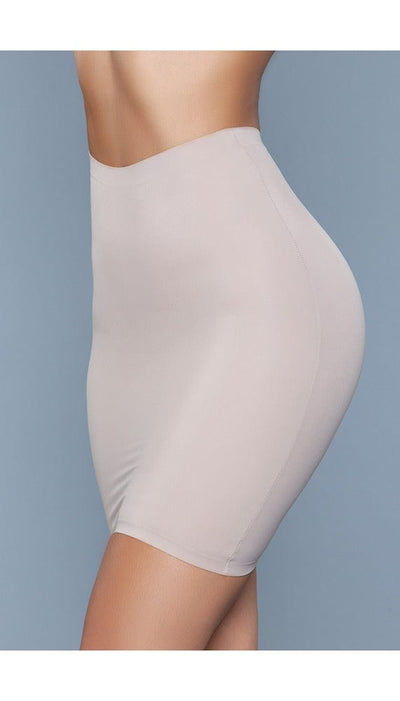 Model wearing seamless high-waist half-slip skirt body shaper in beige facing front left