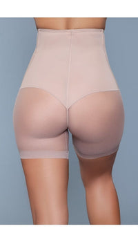 Model wearing high-waist mesh shorts body shaper with waist boning in beige facing back