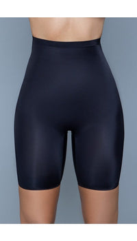 Model wearing seamless mid-waist mid-thigh anti-chafing slip shorts in black facing forward