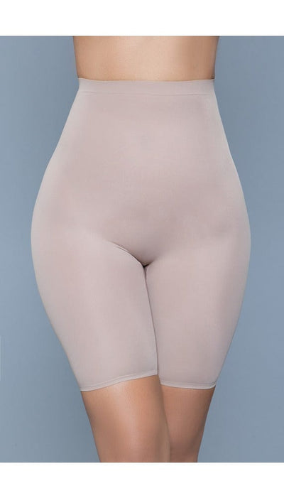 Model wearing seamless mid-waist mid-thigh anti-chafing slip shorts in beige facing forward