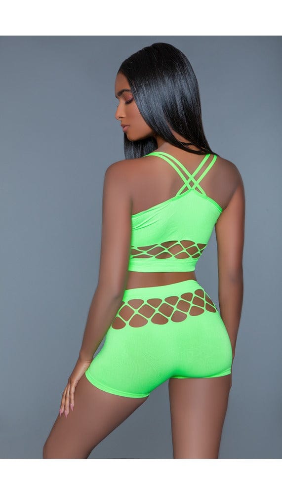 2 pc silk fishnet set that includes a tank crop top with crisscross cami straps and a pair of high-waisted booty shorts in green facing back left