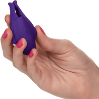 Image of model holding the purple nipple clamp.
