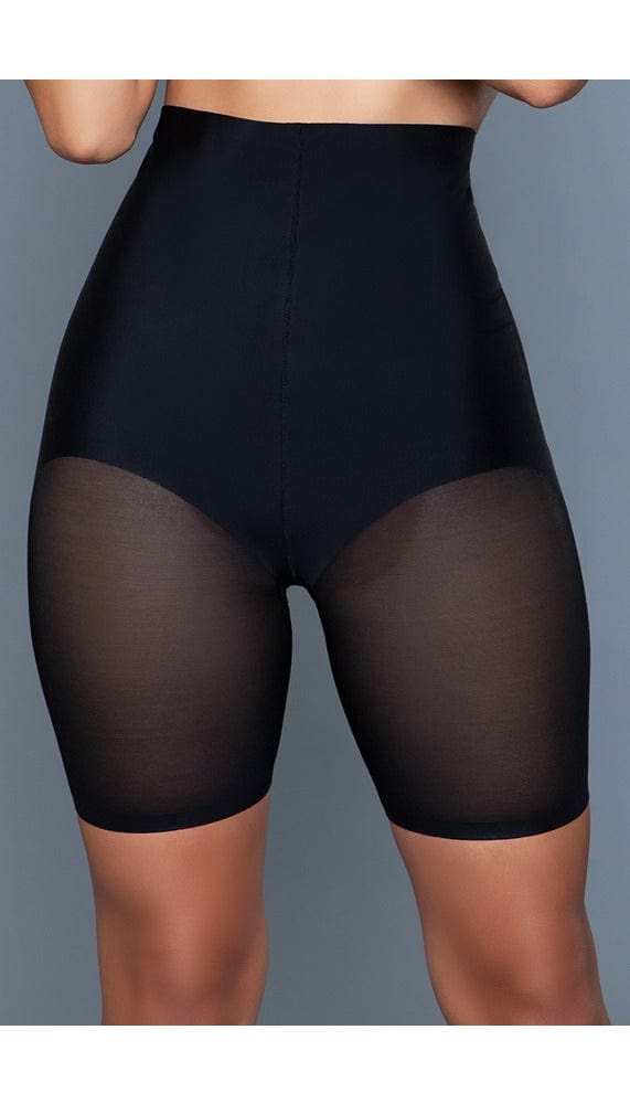 Model facing wearing high-waisted shapewear shorts in black facing forward close up