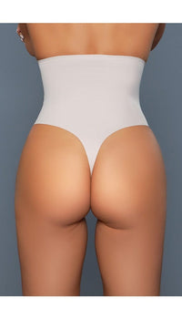 Model wearing seamless high-waisted tummy control body shaper with no panty lines in beige facing back close up