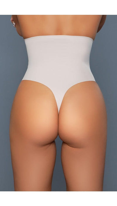 Model wearing seamless high-waisted tummy control body shaper with no panty lines in beige facing back close up