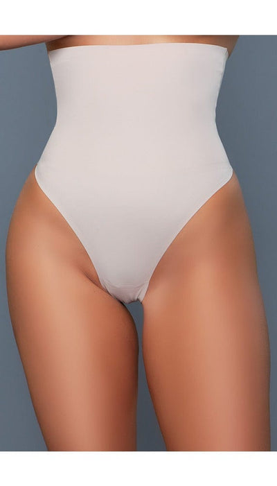 Model wearing seamless high-waisted tummy control body shaper with no panty lines in beige facing foward close up