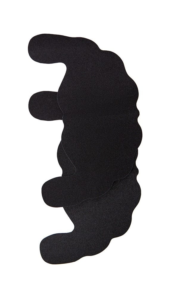 Close up view of black breast lifting stickers.