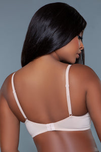 Model facing backward showing back straps and clasp of beige bra
