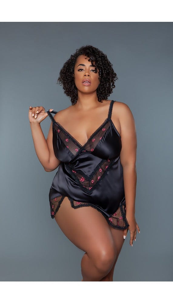 Black babydoll dress with sheer panels.