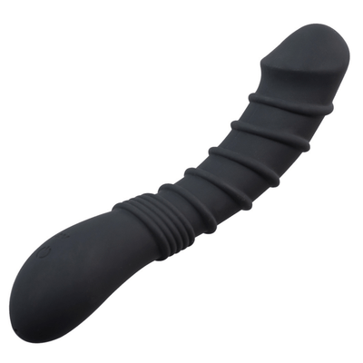 Image of the vibrating dildo, laying down and turned slightly to the side, with the handle in front.