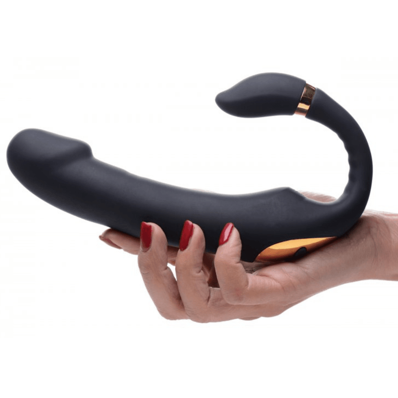 Image of hand holding the bottom of the vibrator from the side.