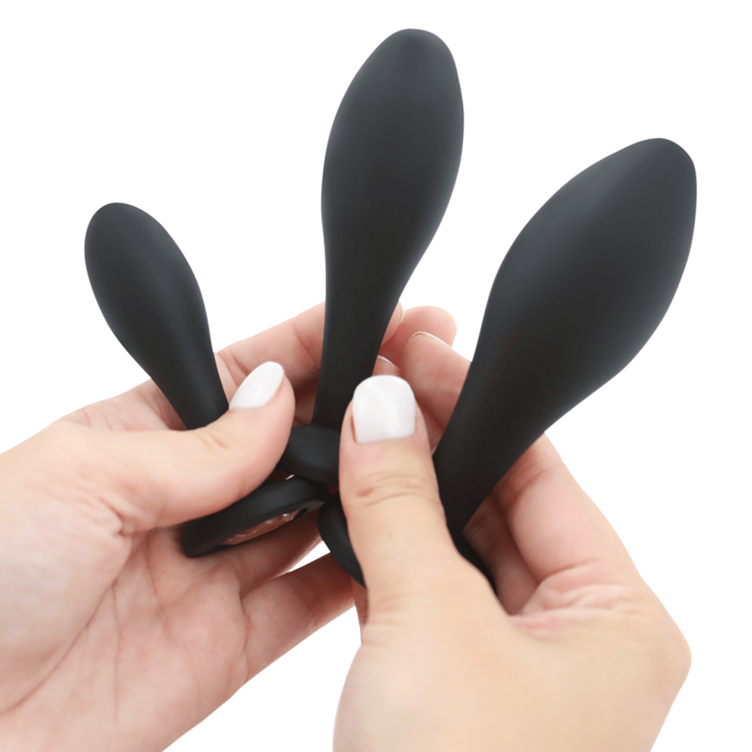 Image of all three anal plugs being held in hands.