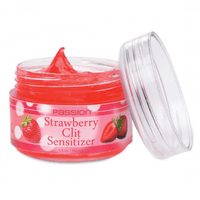 Image of the strawberry flavored clit sensitizer opened, with the lid leaning up against the jar.