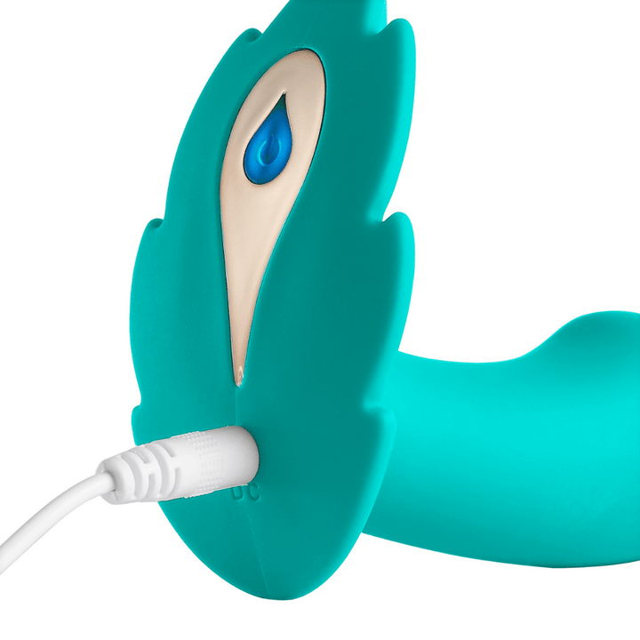 Image of the panty leaf vibrator being charged, with the charging cord plugged in.