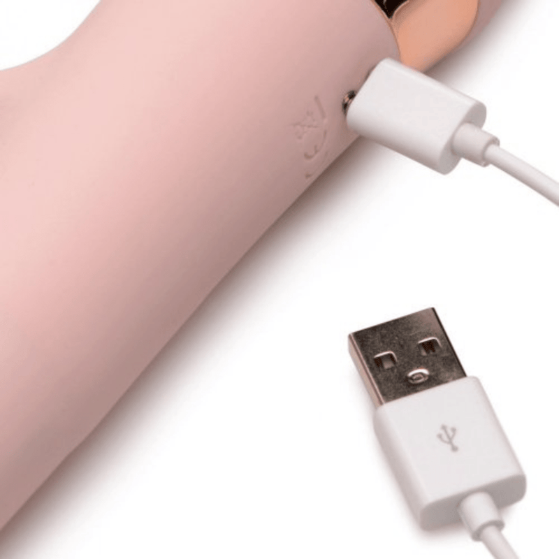 Sliding ring rabbit vibrator close up of charging cord.