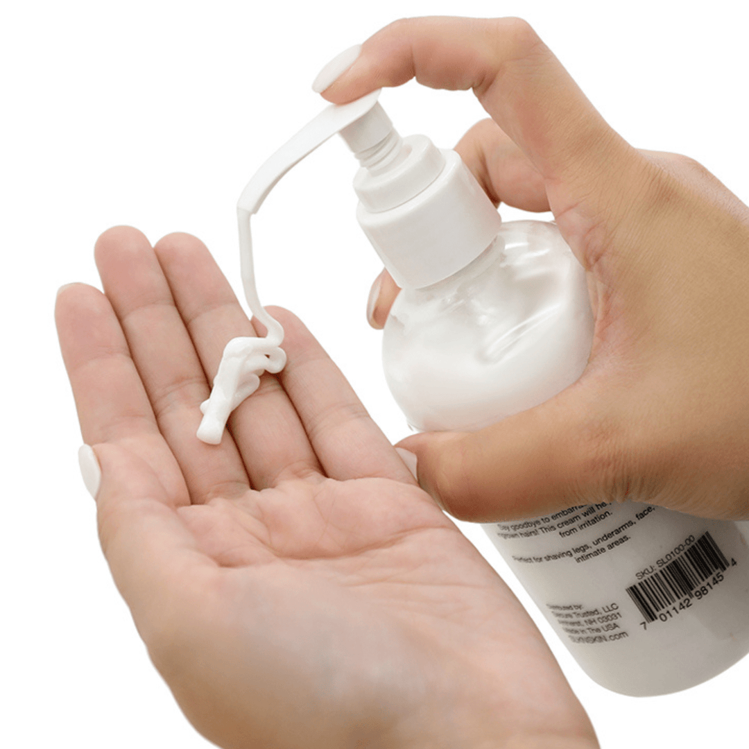 Image of hand pumping out the shave cream into hand.