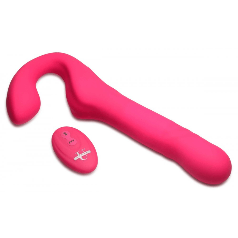 Image of the strap-on laying down on its side with the wireless remote next to it.