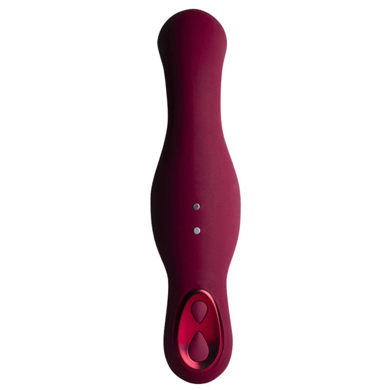 Image of the back of the vibrator, showing the control buttons and magnetic charging port.